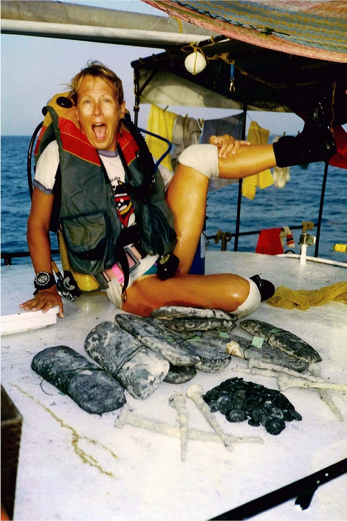 Kathryn Budde-Jones Posing with Silver Bars Recovered on the Florida Treasure Coast and Kathryn Budde-Jones Posing