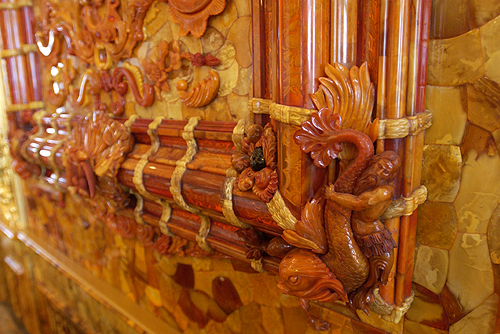 up close image of detailed engravings and decorations on the walls 